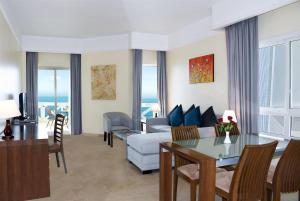 A seating area at Ramada by Wyndham Beach Hotel Ajman