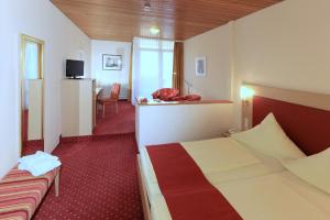 מיטה או מיטות בחדר ב-Hotel Hirschen
