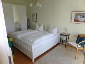 En eller flere senge i et værelse på Ferienhaus Friedrich-Borge-Straße