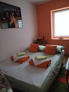 a bedroom with a large bed with pillows on it at Tamara in Vrdnik