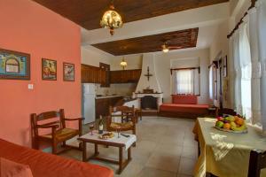 a living room and kitchen with a table and chairs at Diplomats' Holidays in Chorto