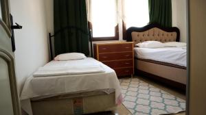 Postelja oz. postelje v sobi nastanitve Lily Guest House with Amazing View House with Garden