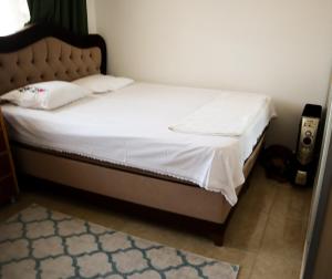 Postelja oz. postelje v sobi nastanitve Lily Guest House with Amazing View House with Garden