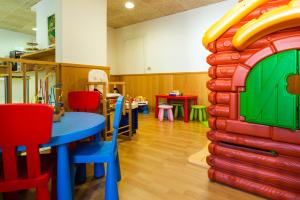 a room with a play room with a bounce house at Hotel Sant March in Tossa de Mar