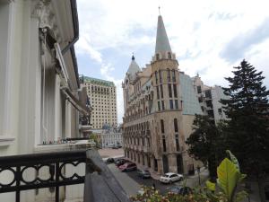 a view from a balcony of a building with a steeple at Apartment on St. Nikoloz Baratashvili 1 in Batumi