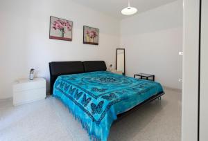 A bed or beds in a room at Casa Baleari 28C