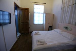 Postel nebo postele na pokoji v ubytování Kidalyo Hotel - Special Category