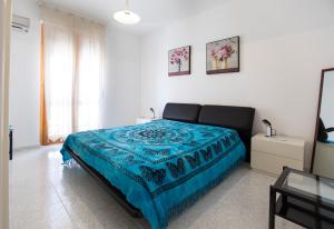 A bed or beds in a room at Casa Baleari 28C