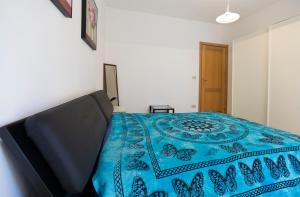 A bed or beds in a room at Casa Baleari 28C