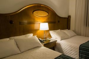Letto o letti in una camera di Johnscher by SJ - San Juan Curitiba