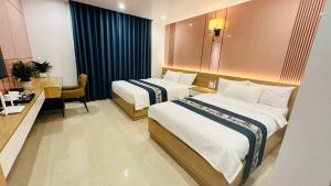 Postel nebo postele na pokoji v ubytování Hestia Hotel