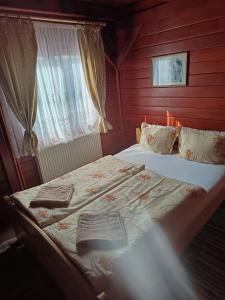Voodi või voodid majutusasutuse Casa Sóhegy Praid toas