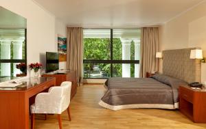 Postel nebo postele na pokoji v ubytování Theoxenia Residence + 37 fotografií