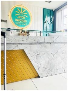 a marble counter with a ramp in a lobby at HOTEL MID-TOWN In Aligarh UP in Alīgarh