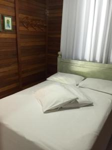 Кровать или кровати в номере Pousada Jardim da Chapada