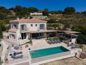 an aerial view of a house with a swimming pool at Villa Filakia in Ratzakli in Ratzaklíon