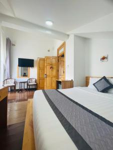 Voodi või voodid majutusasutuse Dalat Wind Hotel toas