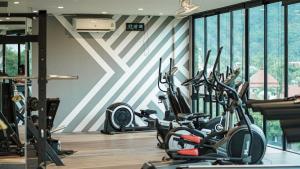 a gym with a bunch of exercise bikes in it at C118 Rooftop Pool Condo Walk to Beach, Gym, Wi-Fi in Kamala Beach