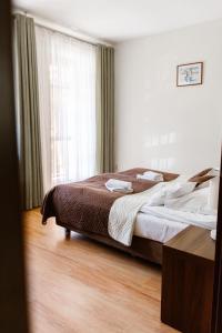 Posteľ alebo postele v izbe v ubytovaní Aparthotel Bellamonte