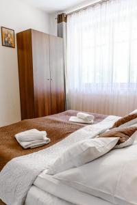 Posteľ alebo postele v izbe v ubytovaní Aparthotel Bellamonte