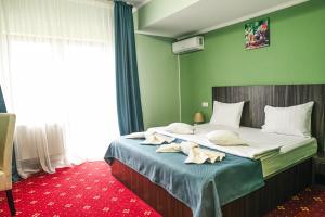 Postel nebo postele na pokoji v ubytování Hotel Aby Baile Felix