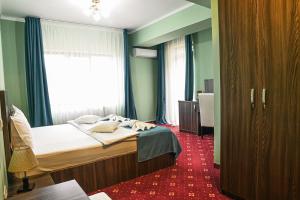 Postel nebo postele na pokoji v ubytování Hotel Aby Baile Felix