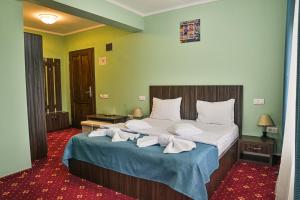 Postel nebo postele na pokoji v ubytování Hotel Aby Baile Felix