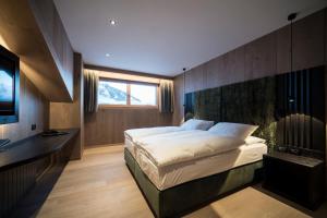 Postel nebo postele na pokoji v ubytování Hotel Cappella