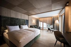 Postel nebo postele na pokoji v ubytování Hotel Cappella