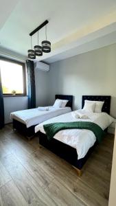 Katil atau katil-katil dalam bilik di Aparthotel w Dolinie Stawów Zator