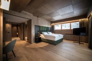 Postel nebo postele na pokoji v ubytování Hotel Cappella
