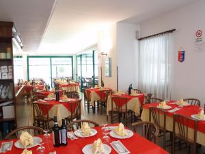 
a restaurant with tables and chairs in it at Villa Emma in Nago-Torbole
