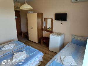 Ein Bett oder Betten in einem Zimmer der Unterkunft Вила Фернандес