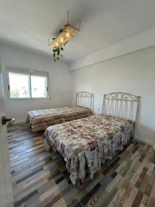 Ένα ή περισσότερα κρεβάτια σε δωμάτιο στο Deniahome Angie