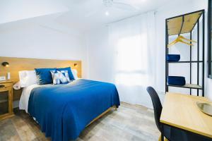 Ένα ή περισσότερα κρεβάτια σε δωμάτιο στο Costa Granada Motril