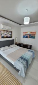 Ένα ή περισσότερα κρεβάτια σε δωμάτιο στο Moda Marine Luxury Homes