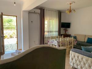 a living room with a couch and a table at Villa Reshat Caca in Ksamil