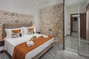 Postel nebo postele na pokoji v ubytování Anassa 14 Luxury One Bedroom Maisonette