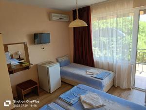 Ein Bett oder Betten in einem Zimmer der Unterkunft Вила Фернандес