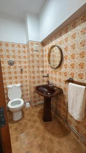 a bathroom with a toilet and a sink at Varanda do Coura in Caminha +18 photos
