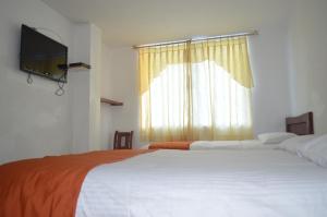 Postel nebo postele na pokoji v ubytování Hotel Ventura
