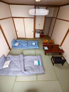 Letto o letti in una camera di 旅館青柳 海越し立山連峰の雪山絶景で休もう