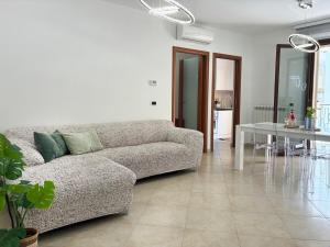 a living room with a couch and a table at Holihome Mondo Serena in Tortoreto Lido