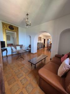 a living room with a couch and a table at vue mer in Farinole