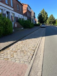 a car parked on the side of a street at Dähre Wohnung 3 in Niederdorla +1 photo