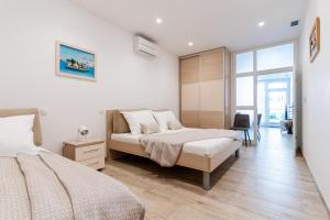 Ένα ή περισσότερα κρεβάτια σε δωμάτιο στο Villa Kogo +69 φωτογραφίες