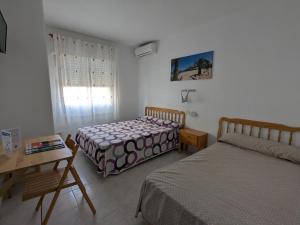 Postel nebo postele na pokoji v ubytování La Obrera