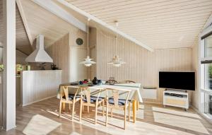 a kitchen and dining room with a table and chairs at Stunning Home In Humble With Wifi in Humble