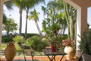 A garden outside Temenos Villa by Ortigiaapartments