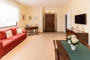 TV a/nebo společenská místnost v ubytování Corte dei Nobili Apartment